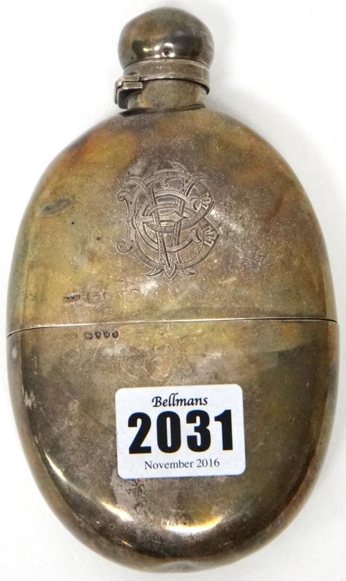 A Victorian silver spirit flask, of oval form, monogram engraved with a pull-off beaker base, London 1887, weight 182 gms.