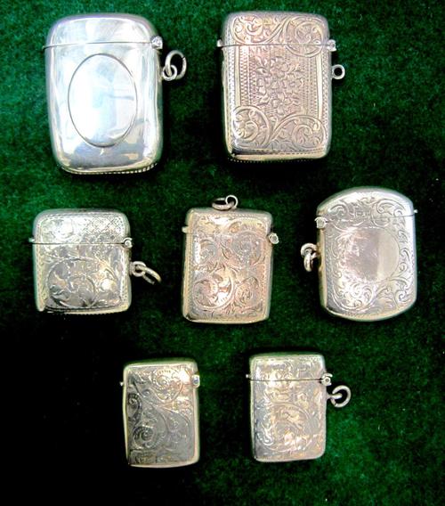 A silver rectangular vesta case, with floral engraved decoration, Birmingham 1906, a silver rectangular vesta case, Birmingham 1909 and five further s