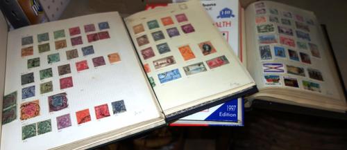A quantity of assorted stamps, some in albums.   S1M