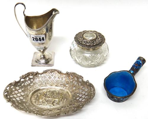 A silver helmet shaped cream jug, decorated with an engraved band within a beaded rim, London 1793, a silver lidded faceted glass hair tidy jar, Birmi