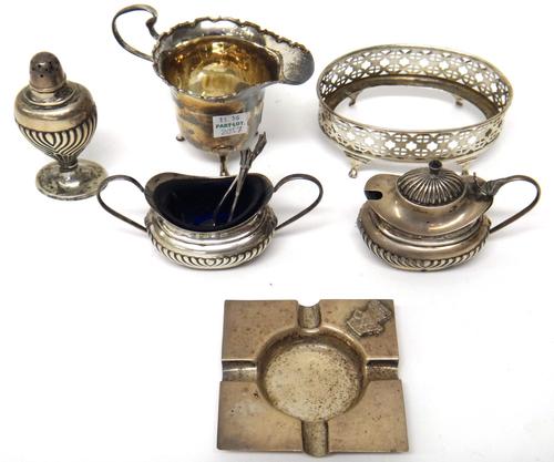 Silver, comprising; a three piece condiment set with partly fluted decoration, Birmingham 1897, two silver condiment spoons, a cream jug, Birmingham 1