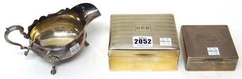 A silver rectangular table cigarette box, wooden lined within, the lid with banded decoration, Sheffield 1928, a silver square table cigarette box, wo