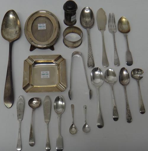 Silver and silver mounted wares, comprising; a square ashtray, an oval photograph frame, a napkin ring, a pepperette, two mustard spoons, a pair of su