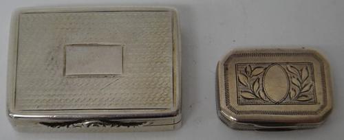 A silver rectangular vinaigrette, the exterior engine turned, with a moulded thumbpiece, with a scroll pierced and engraved grille, fitted with a larg