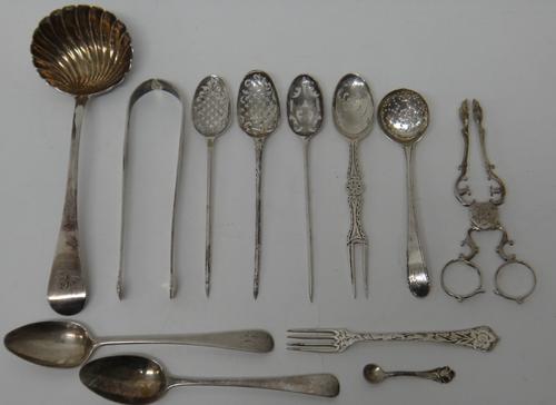 Three Mote spoons, with spike finials to the handles, probably 18th century, a silver Old English and shell pattern sauce ladle, probably London 1820,