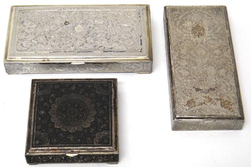 A Middle Eastern rectangular hinge lidded box, with floral and scroll engraved decoration, probably Persian, a similar rectangular hinge lidded box, r