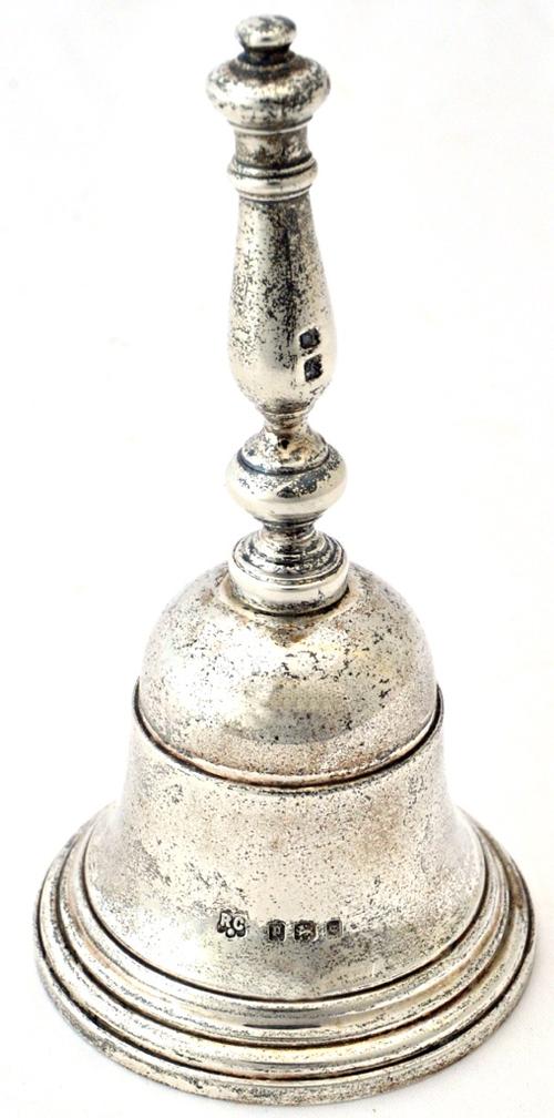 A silver call bell, maker William Comyns & Sons Ltd, London 1930, height 11cm, weight 174 gms. Illustrated.