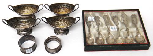 Silver, comprising; two pairs of Victorian twin handled boat shaped salts, with embossed decoration in the Eastern taste, London 1889 and London 1891