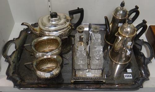 Plated wares, comprising; a shaped rectangular twin handled tray, a three piece tea set, a two piece cafe au lait set and a cruet frame fitted with si