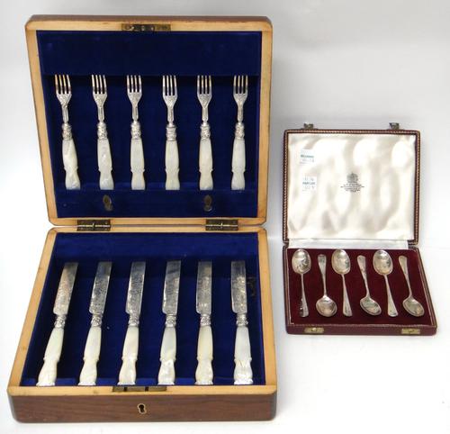 A Victorian set of six pairs of silver dessert or fruit knives and forks, with mother of pearl handles and with engraved decoration, Sheffield 1850, w
