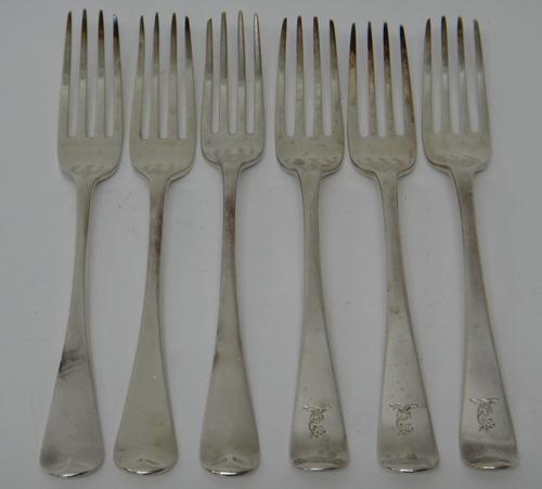 Three George III silver Old English pattern table forks, London 1803 and three further silver Old English pattern table forks, various dates, weight 3