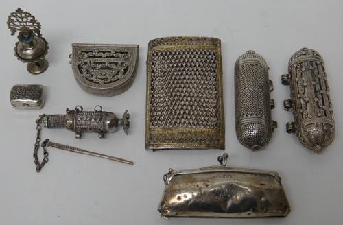 A lady's silver purse, fitted with a carrying chain, Birmingham 1918 and a collection of Eastern wares, comprising; two torpedo shaped containers, eac