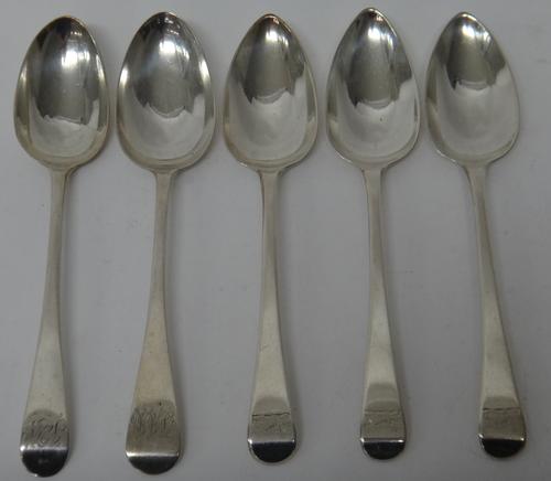 Three George III silver Old English pattern tablespoons, crest engraved, London 1803 and two further silver Old English pattern tablespoons, London 18