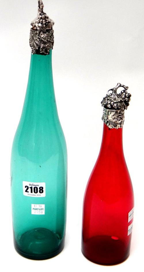 A Victorian silver mounted green glass wine bottle, decorated with fruiting vine and a silver mounted cranberry coloured glass wine bottle, decorated