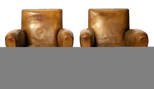 A pair of George II silver sauceboats,each with a scrolling handle, gadrooned rim and raised on three feet, one London 1748, the other hallmark rubbed