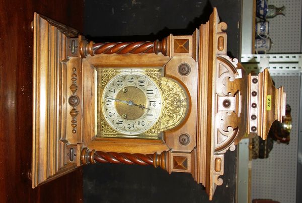 A 19th century walnut cased eight day mantel clock.  DIS
