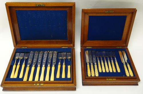 A set of eighteen pairs of Victorian fish knives and forks, the plated blades and prongs with pierced and engraved decoration and with ivory handles,