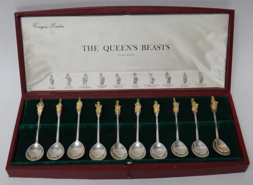 A cased set of ten silver and gilt spoons, the finials detailed with differing Royal beasts, the interior of the box detailed 'The Queen's Beasts', th