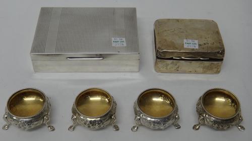 A silver rectangular table cigarette box, wooden lined within, a smaller silver rectangular table cigarette box, wooden lined within and a set of four