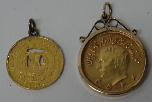 An Iranian gold pahlavi, in a gold pendant mount, gross weight  9.8 gms and a South Africa gold half pond 1896, pierced to the centre and fitted with