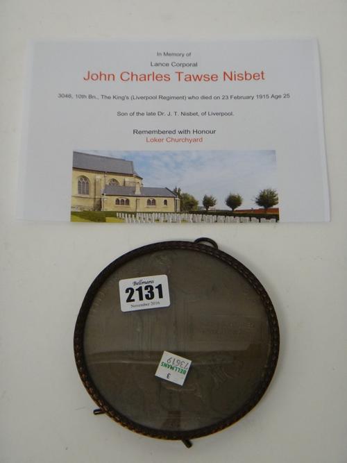 A First World War period bronze memorial plaque, detailed John Charles Tawse Nisbet, displayed in a strut backed glazed frame, he served with The 10th