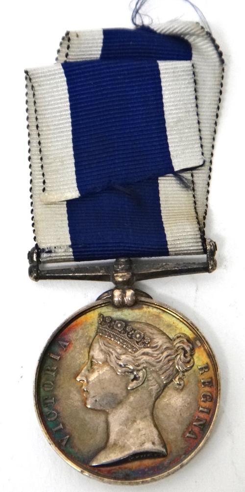 A Victorian Naval Long Service and Good Conduct Medal, with engraved naming detailed HY L.WOODESON WRITER. H.M.S. DUKE of WELLINGTON, (correction to t