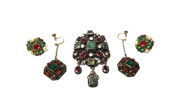 A Renaissance revival style cultured pearl, foiled backed beryl and red gem set pendant brooch, the front with three pendant drops (one red gem lackin