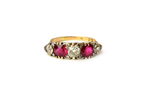 A gold, ruby and diamond five stone ring, mounted with three cushion shaped diamonds alternating with two cushion shaped rubies, the mount decorated w