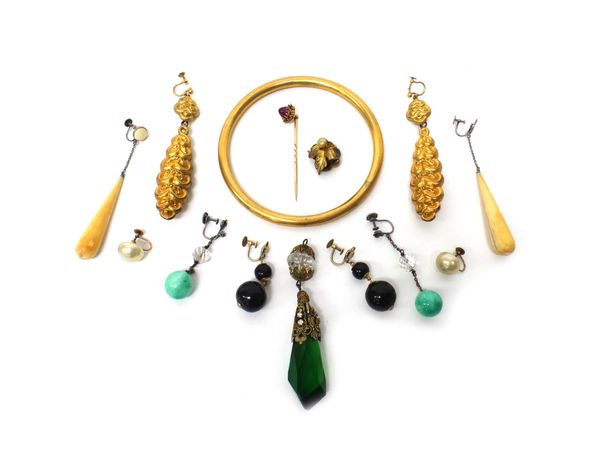 A pair of Victorian gilt metal pendant earrings, five further pairs of earrings, a gilt metal circular bangle, a stick pin mounted with a cabochon rub