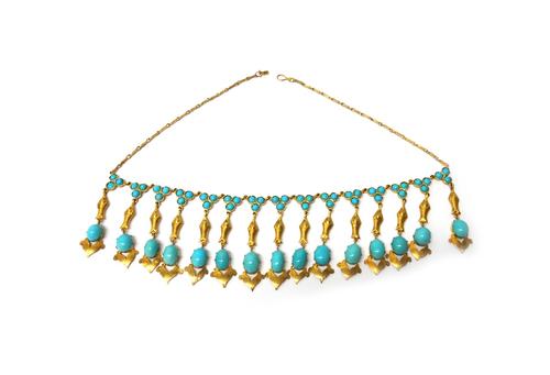 A gold and turquoise fringe necklace, the front designed as a row of drops, with the principal oval turquoise set to the terminals and with turquoise