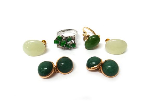 A jade and diamond ring, mounted with six pear shaped jades and otherwise set with circular cut diamonds, a gold ring mounted with an oval nephrite, a