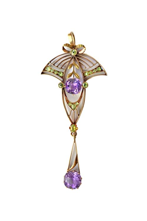 A Russian amethyst and demantoid garnet set pendant, in an Art Nouveau fanned and foliate design, detailed 56. Illustrated.