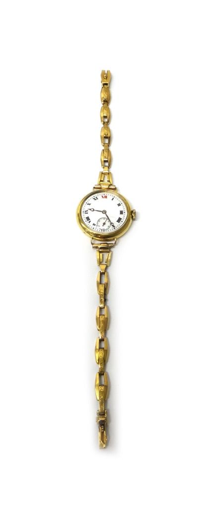 A lady's 18ct gold circular cased wristwatch, with a gilt jewelled lever movement, 18ct gold inner case, the enamelled dial with Roman numerals and wi