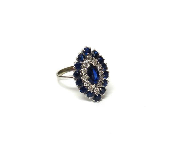 A 14ct white gold, sapphire and diamond marquise shaped cluster ring, mounted with the principal marquise sapphire at the centre, in a surround of cir