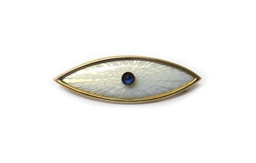 A Russian gold, cabochon sapphire and pale blue enamelled oval brooch, centred by a cabochon sapphire, on a pale blue enamelled ground, detailed 56 M