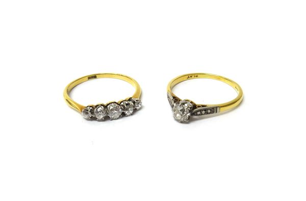 A gold and diamond set five stone ring, claw set with a row of cushion shaped diamonds graduating in size to the centre stone, detailed 18 CT, ring si