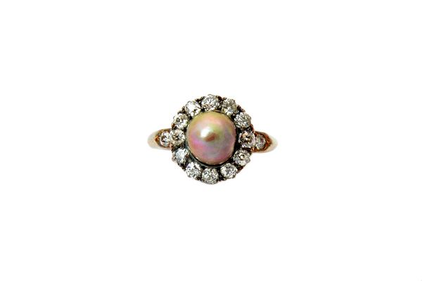 A gold, diamond and grey tinted cultured pearl cluster ring, mounted with the cultured pearl at the centre, within a surround of cushion shaped diamon