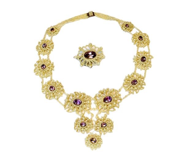 A mother of pearl, seed pearl and foil backed amethyst set collar necklace and brooch, the necklace formed as a row of graduated ovals, each centred b