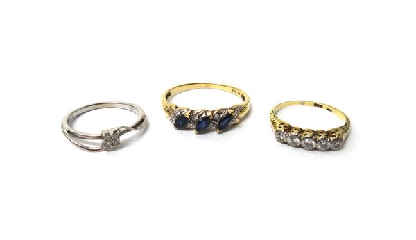 A gold and diamond set five stone ring, mounted with a row of circular cut diamonds, detailed 585, ring size K, a 9ct gold, sapphire and diamond ring,