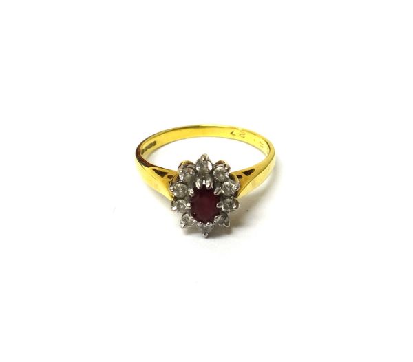 An 18ct gold, ruby and diamond set oval cluster ring, claw set with the oval cut ruby at the centre, within a surround of ten circular cut diamonds, r