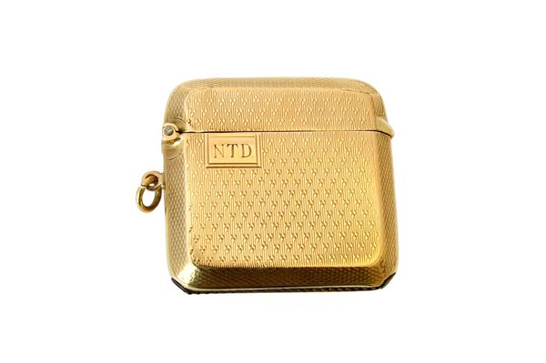 A 9ct gold rectangular vesta case, with engine turned decoration, Birmingham 1929, gross weight 23.5 gms. Illustrated.