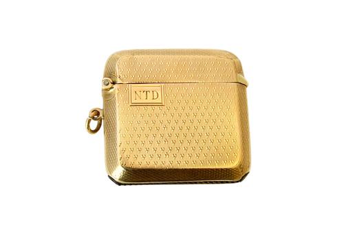 A 9ct gold rectangular vesta case, with engine turned decoration, Birmingham 1929, gross weight 23.5 gms. Illustrated.