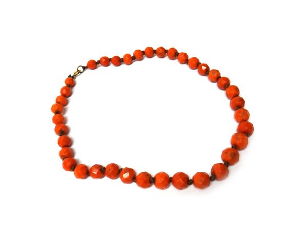 A single row necklace of faceted graduated coral beads, on a boltring clasp, gross weight 73 gms.