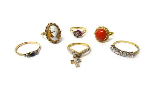 A gold and coral ring, detailed 750, a 9ct gold and diamond set ring, with a diamond set pendant cross charm as fitted, a 9ct gold ring, mounted with