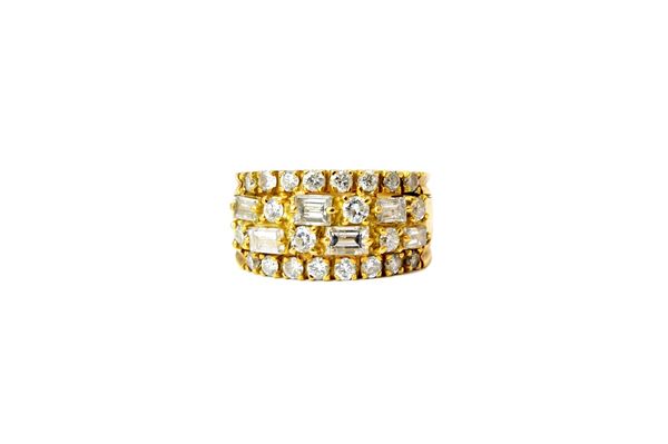 A gold and diamond set ring, the centre mounted with two rows of alternating claw set baguette and circular cut diamonds, between circular cut diamond