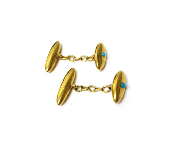 A Victorian pair of gold and turquoise set cufflinks, each with a navette shaped front, centred by a turquoise and with plain torpedo shaped backs, on