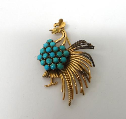 A gold and turquoise set brooch, designed as a stylized cockerel, probably circa 1950.