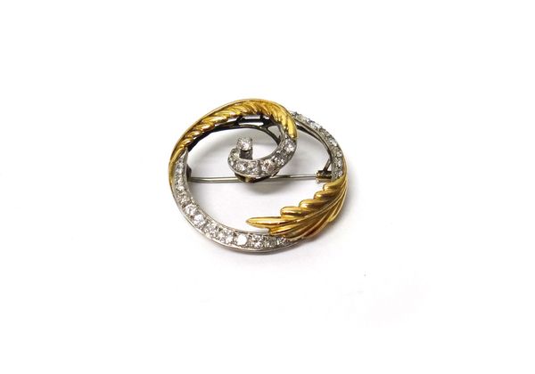 A gold and diamond set circular brooch,decorated with spray motifs, mounted with circular cut diamonds, gross weight 6.5 gms.