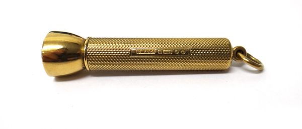 A 9ct gold sprung action cigar pricker, having engine turned decoration by S Mordan & Co, London 1938, gross weight 13 gms.