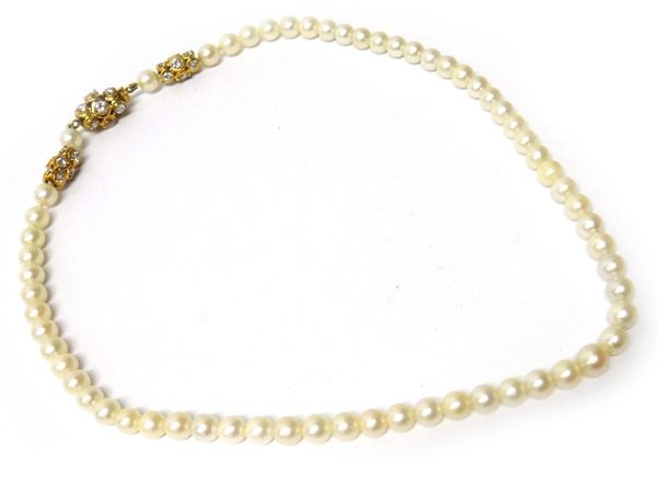 A gold, diamond and cultured pearl choker necklace, the single row of cultured pearls with a gold and diamond set clasp and with two gold and diamond